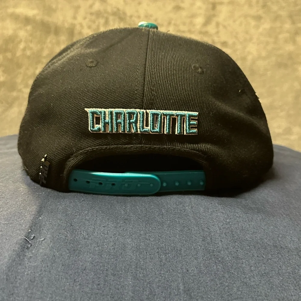PRO Brand Charlotte Hornets Multi-Logo SnapBack Hat.